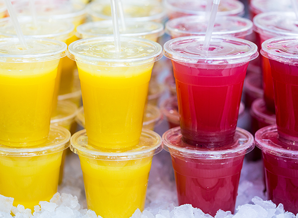 stacks of juices in plastic cups, on ice, ready to go